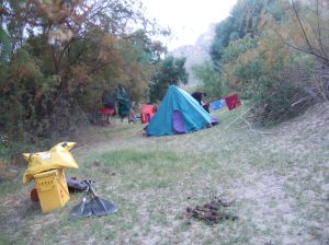 Attempting to dry our gear on our second night.  Yellow portable toilet box in foreground.  Poo beside it not ours.