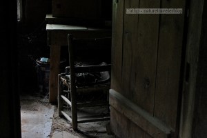 Looking in the office that contained a cot, wood stove, desk, and chair.